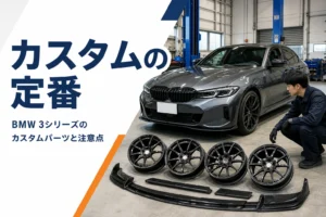 整備工場に停めたスポーツセダンとカスタムパーツ