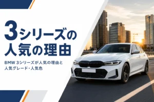 夕方の街を走る白いスポーツセダン